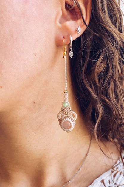 Model wearing handmade macrame earrings featuring rose quartz and prehnite gemstones, showcasing the lightweight, long drop style perfect for any occasion.