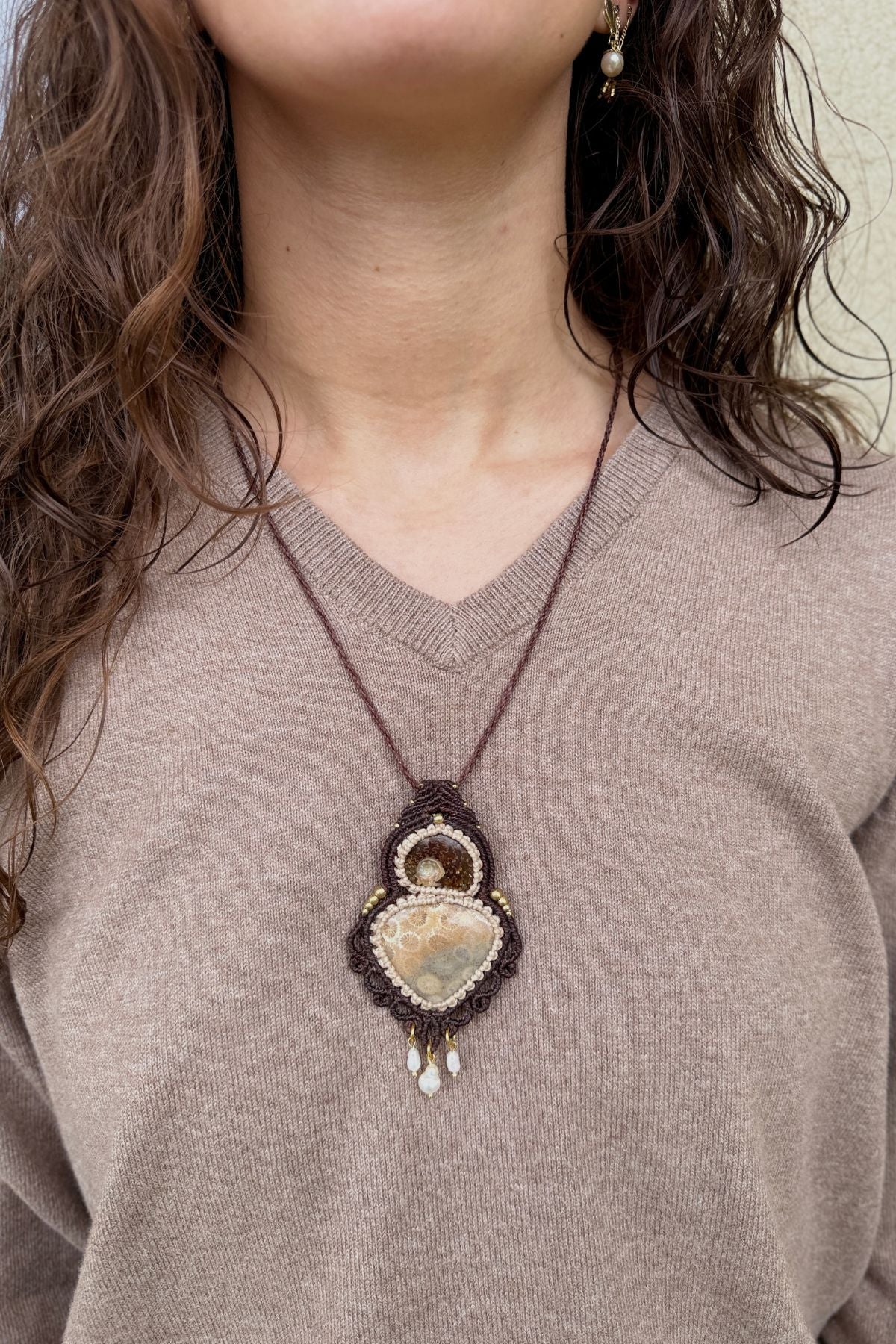 Model wearing rare ammonite and fossil coral statement necklace, one of a kind jewelry