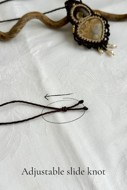 Adjustable slide knot closure on handmade coral fossil statement necklace