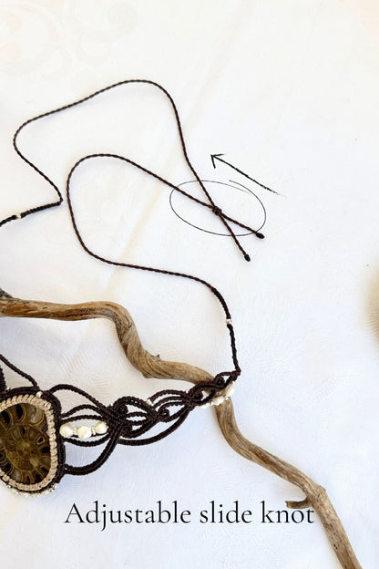 Detail of adjustable slide knot on ammonite fossil statement necklace allowing custom fit for all neck sizes