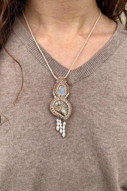 Model wearing opalized ammonite and moonstone statement necklace, ocean inspired one of a kind jewelry