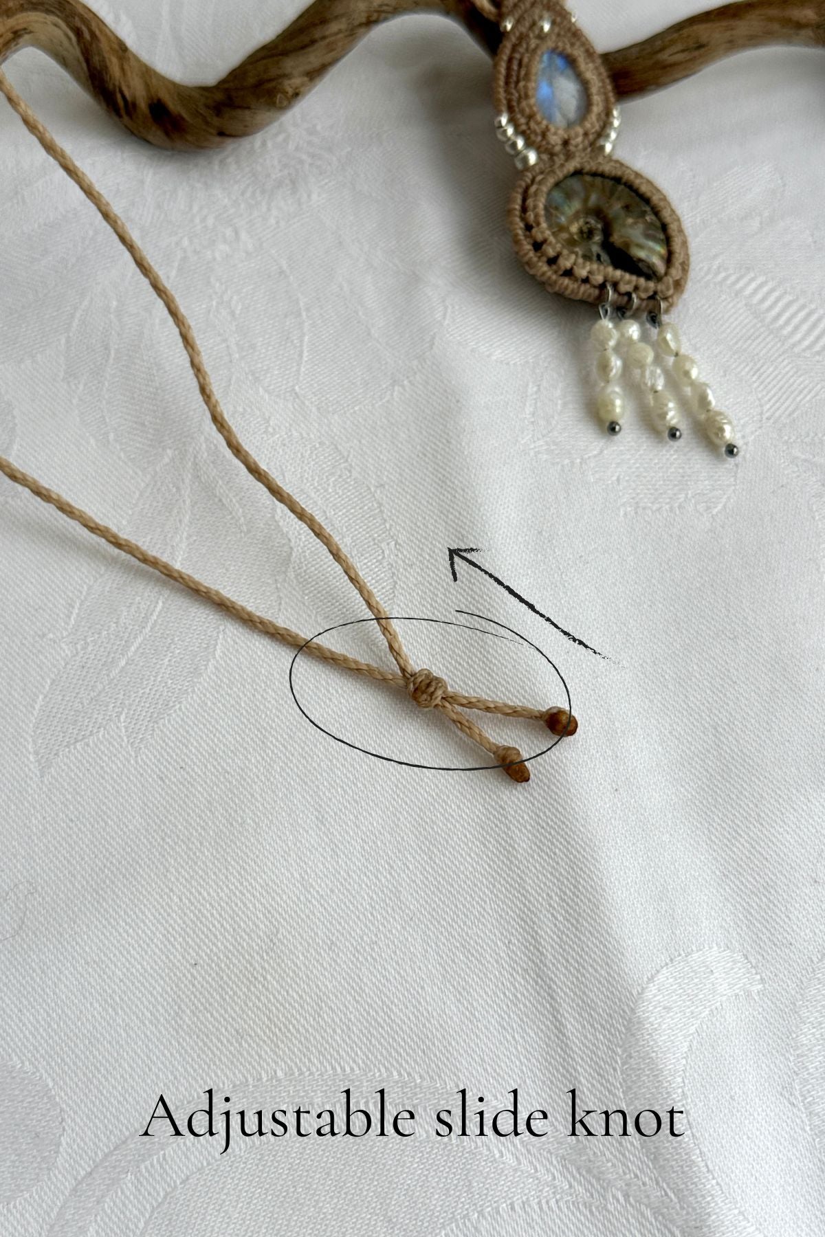 Adjustable sliding knot closure on opalized ammonite fossil necklace