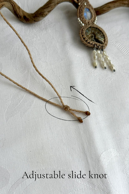 Adjustable sliding knot closure on opalized ammonite fossil necklace
