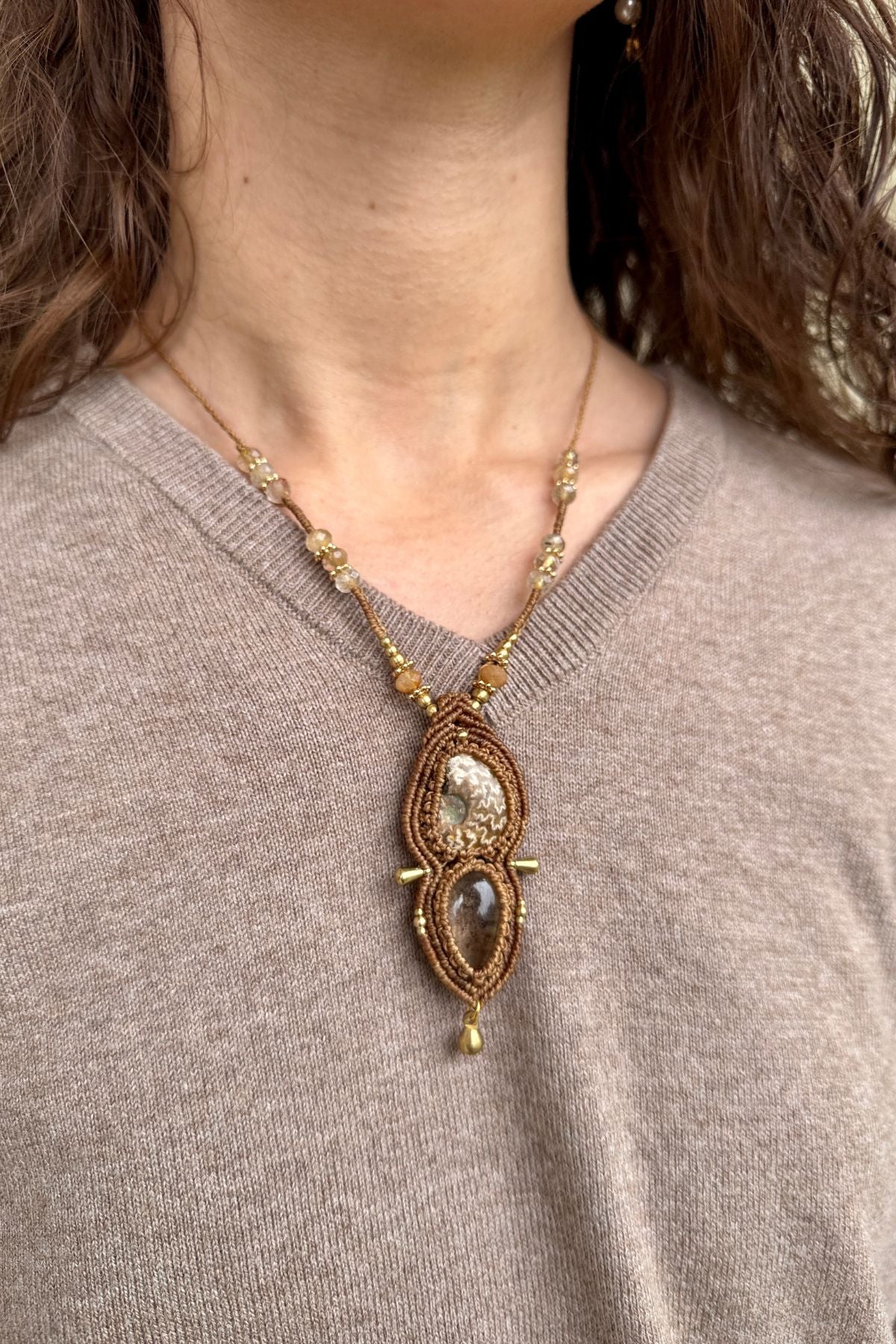 Model wearing rare ammonite and lodolite necklace, one of a kind elegant fossil jewelry