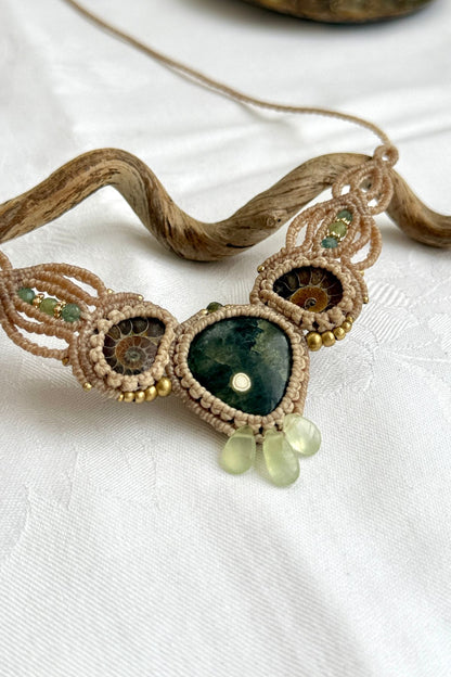 Detailed view of ocean jasper, ammonite fossils, and green prehnite accents in V-shaped design