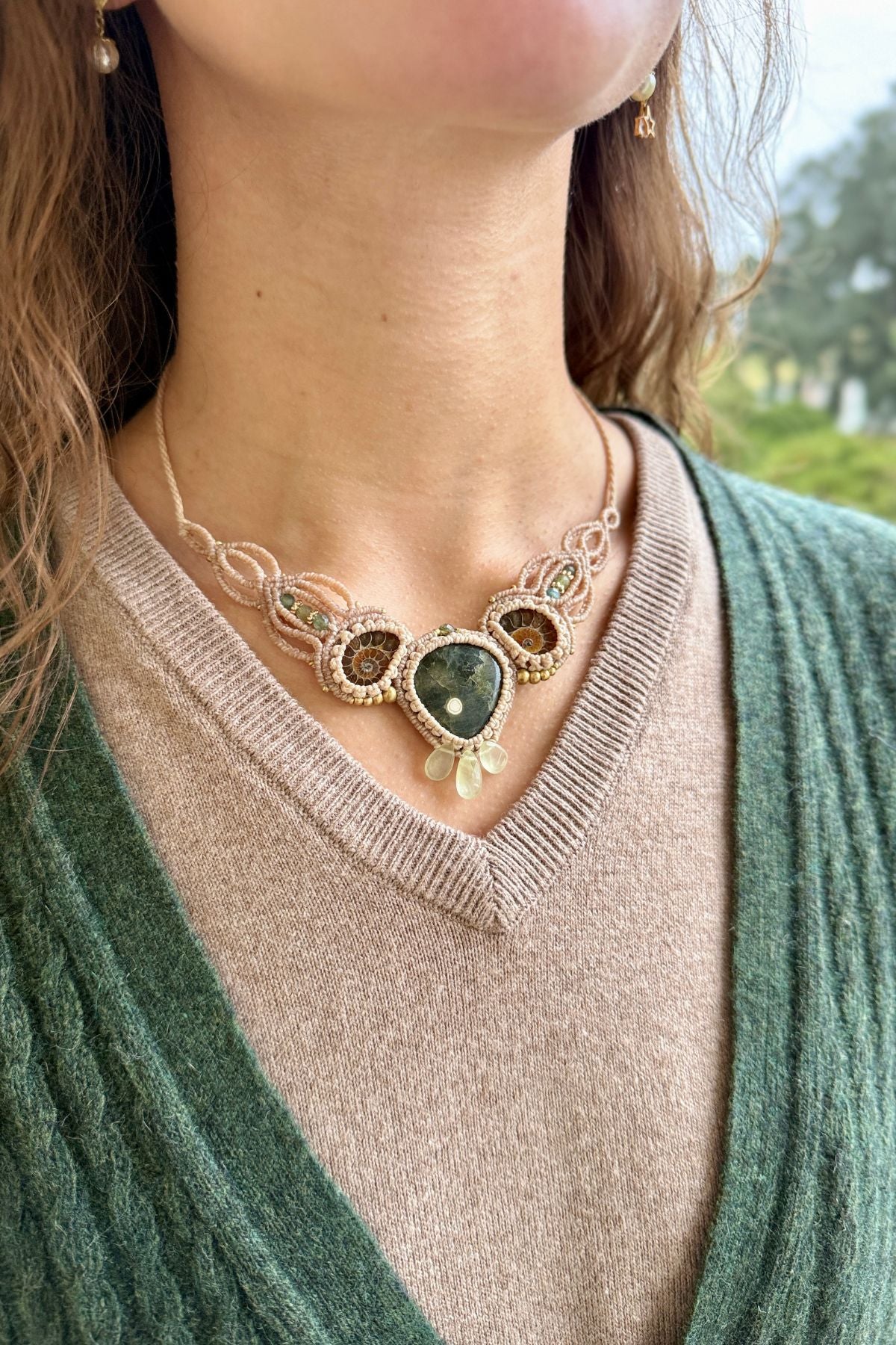 Model wearing rare ocean jasper, split ammonite, and green tourmaline statement necklace, one of a kind jewelry