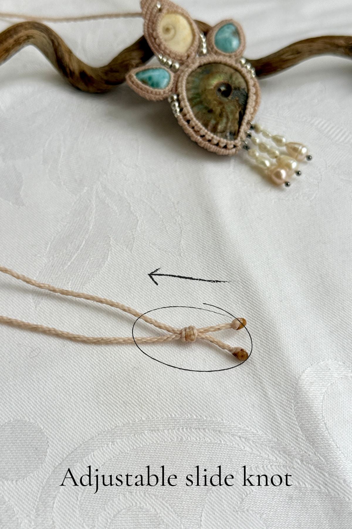 Adjustable sliding knot closure on opalized ammonite fossil necklace