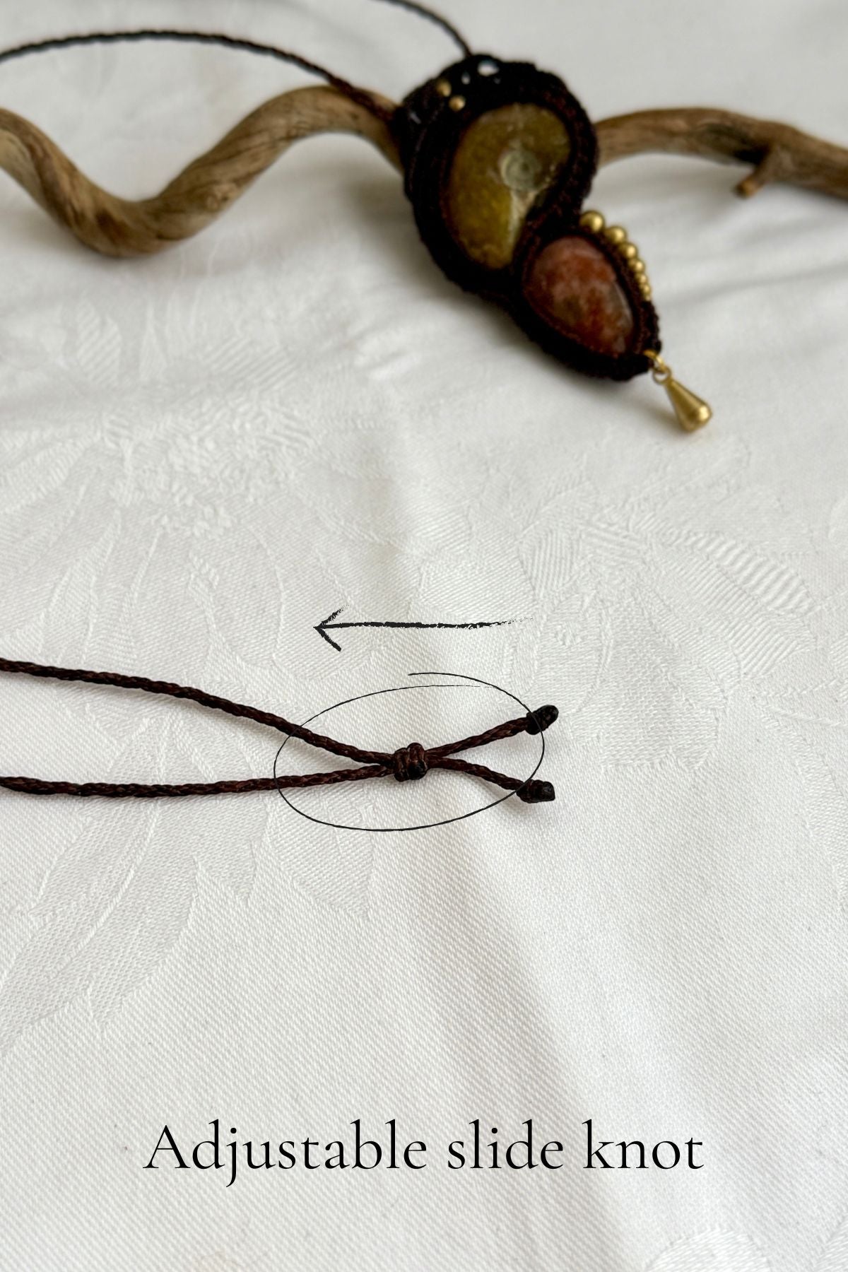 Adjustable sliding knot closure on ammonite and sunstone pendant necklace with asymmetric bead details