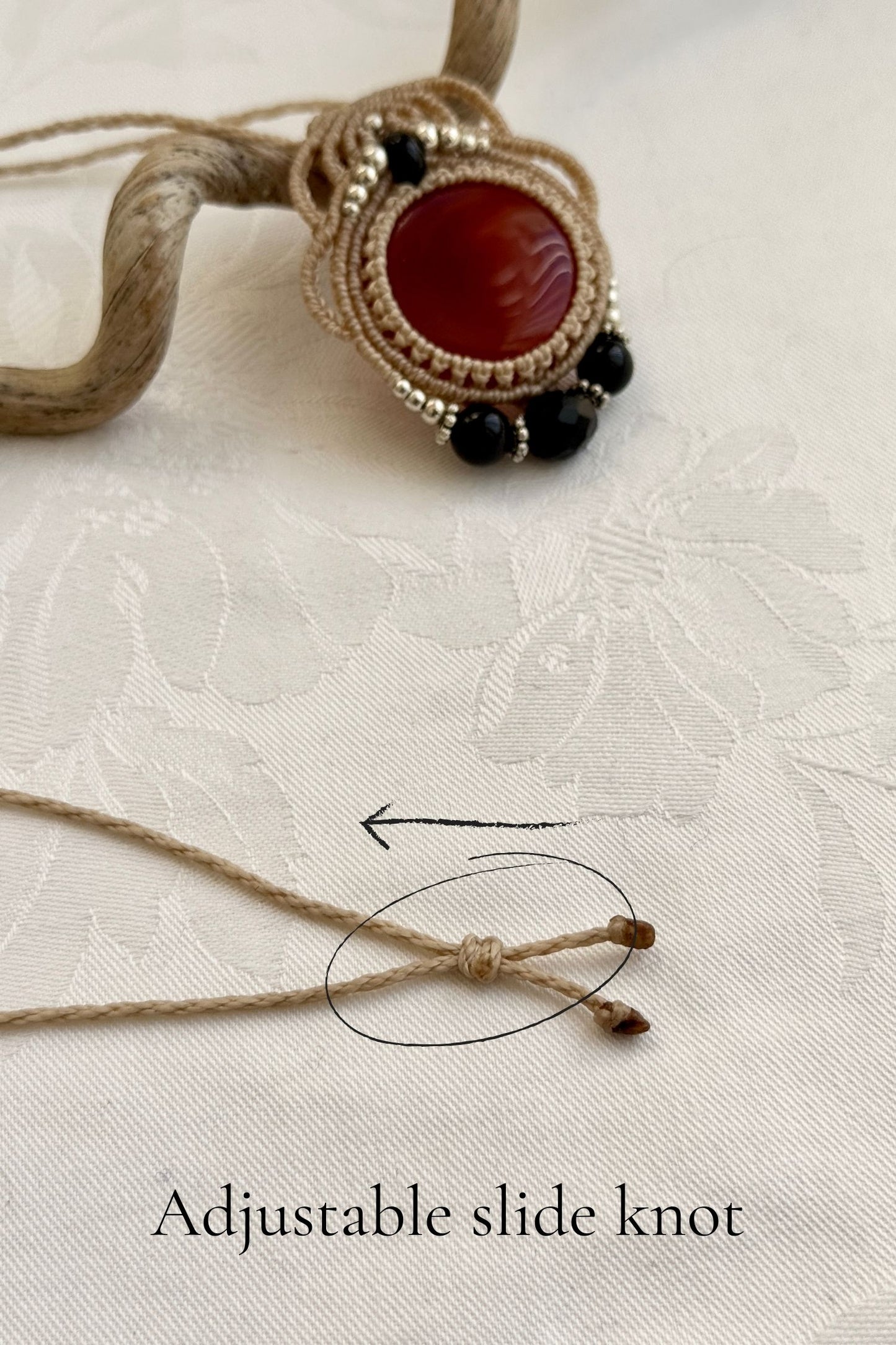 Adjustable handmade macrame necklace with Carnelian and Onyx. Featuring a sliding knot closure for a customizable fit.