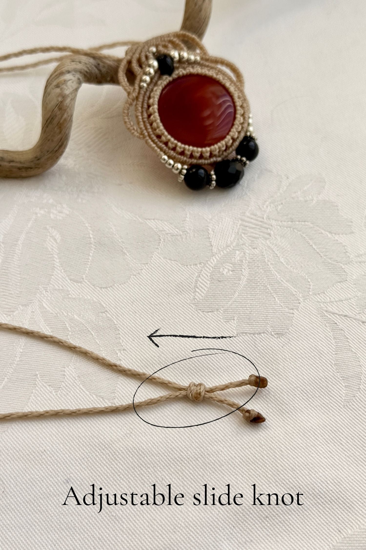 Adjustable handmade macrame necklace with Carnelian and Onyx. Featuring a sliding knot closure for a customizable fit.