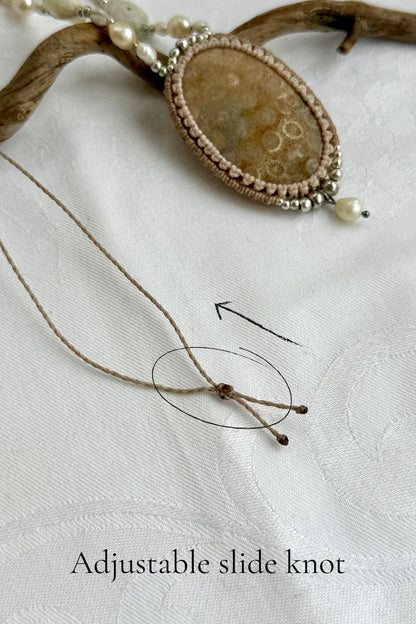 Adjustable slide knot closure on handmade fossil Coral statement necklace