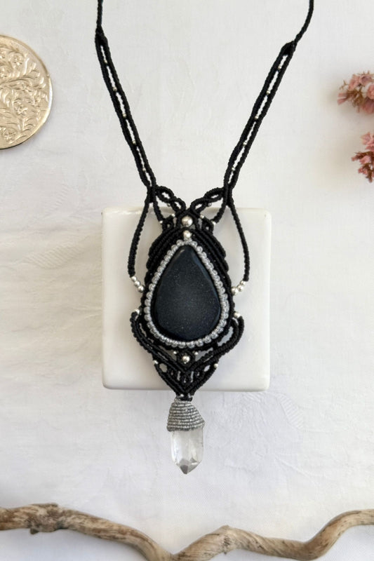 Handmade macrame necklace with Druzy Onyx and Clear Quartz point gemstones, part of the Nocturnal Collection. One-of-a-kind design, laid flat for an artistic display.