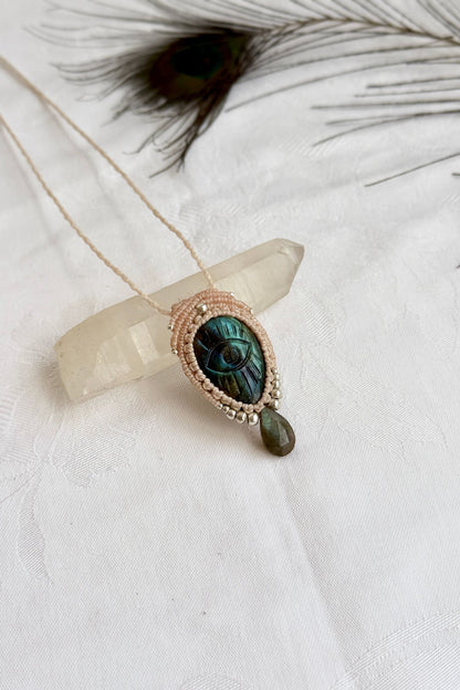 Artisan Labradorite protective eye necklace, shown from another angle to capture gemstone hues faceted dropping tear detail.