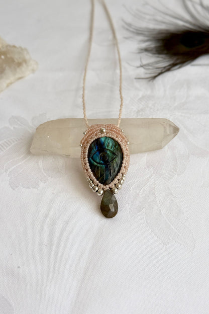 Handmade macrame necklace with Labradorite protective eye pendant, displayed flat to reveal gemstone’s natural labradorescence.