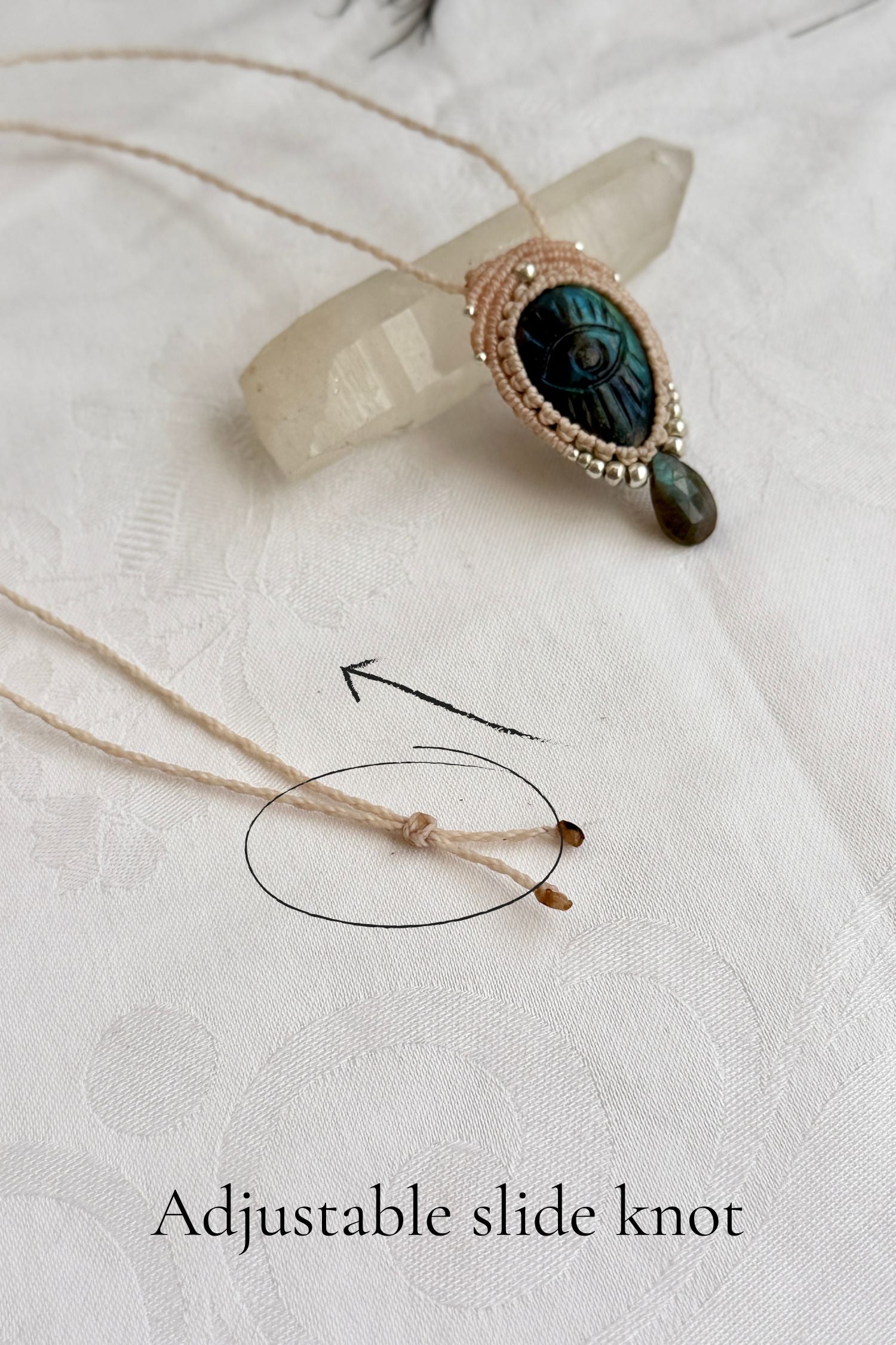 Adjustable sliding knot closure on handmade Labradorite necklace, showing versatile and comfortable fit.