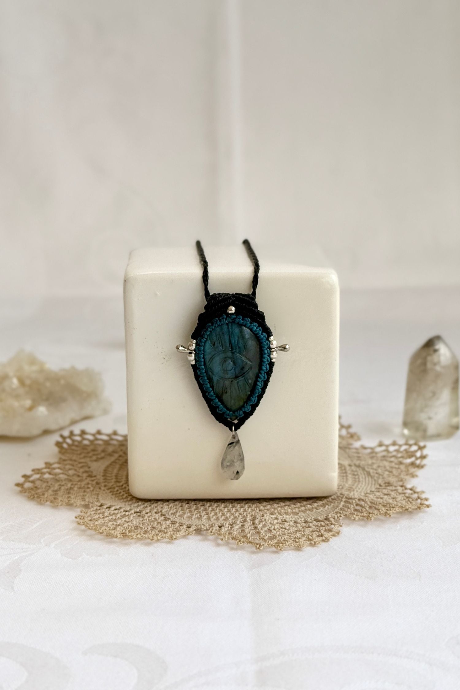 Artisan Labradorite protective eye necklace, shown from another angle to capture the gemstone contrast with the macrame color threads.