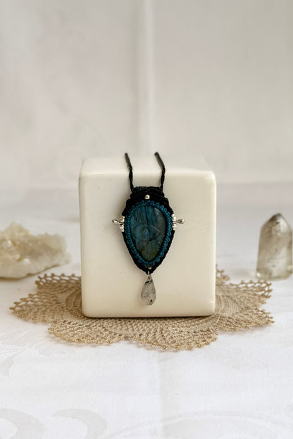 Artisan Labradorite protective eye necklace, shown from another angle to capture the gemstone contrast with the macrame color threads.