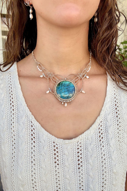 Model wearing a Victorian-inspired Labradorite macrame necklace with freshwater pearls and silver details.