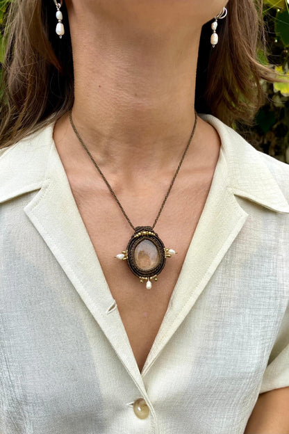 Handmade gemstone necklace worn, showing how the unique Lodolite and Fresh Water Pearls pendant elegantly rests on the neckline.