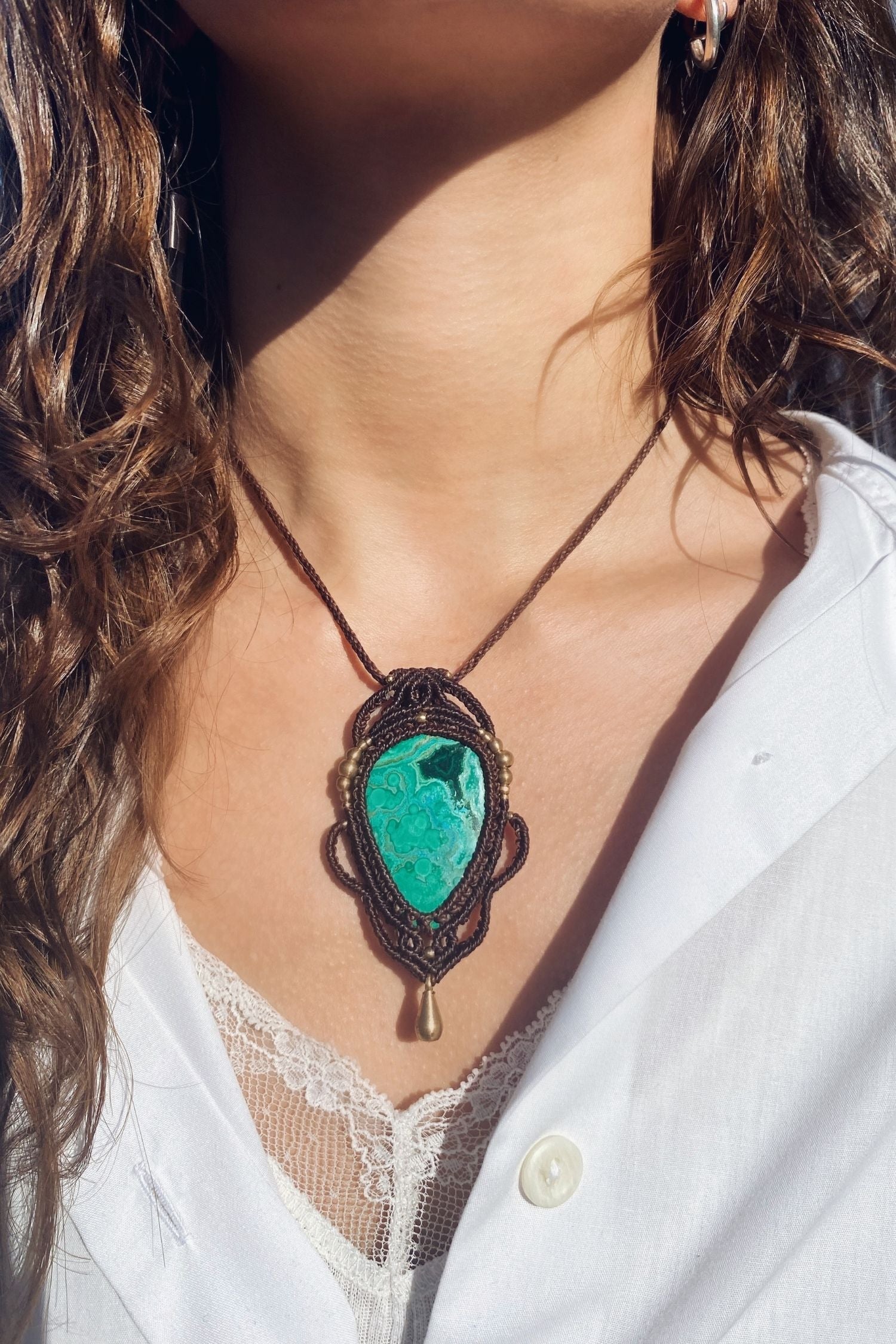Handmade gemstone necklace worn, showing how the unique Malachite with Chrysocolla pendant elegantly rests on the neckline.