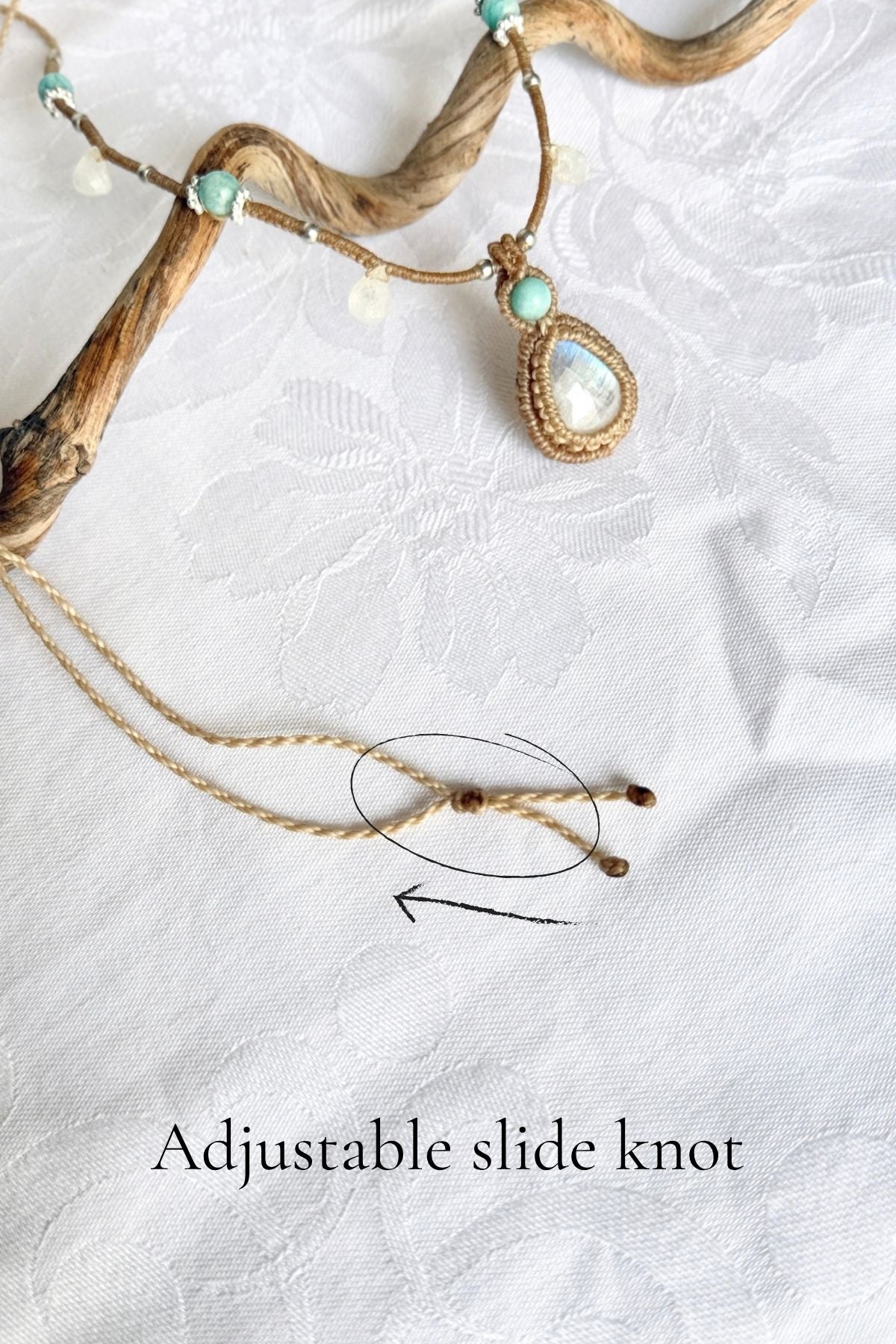 Adjustable sliding knot on the macrame necklace cord, circled and labelled, with the Moonstone and Amazonite pendant above.