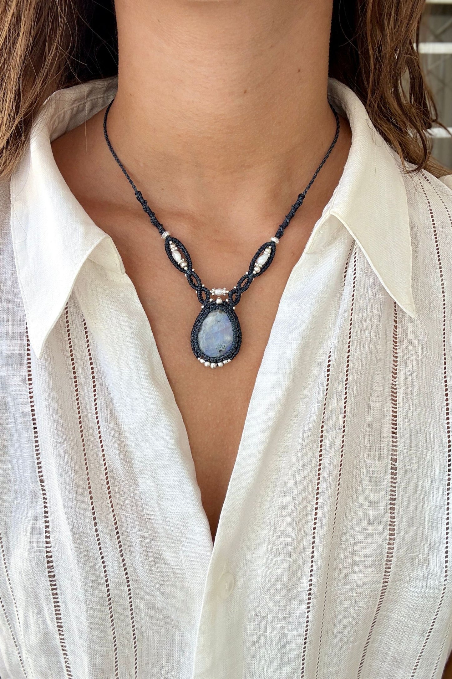 Model wearing a V-shaped Moonstone macrame statement necklace with Freshwater Pearl accents