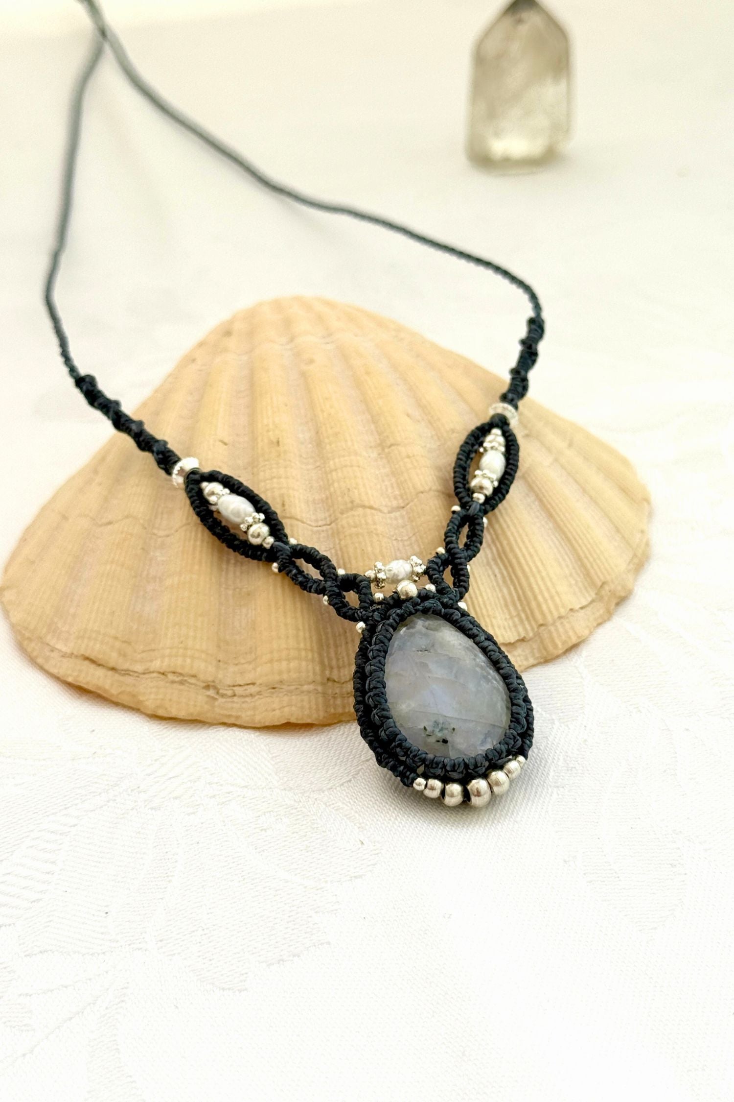 Another Side view of a handmade Moonstone macrame necklace showing the flashes and natural beauty of the gemstone