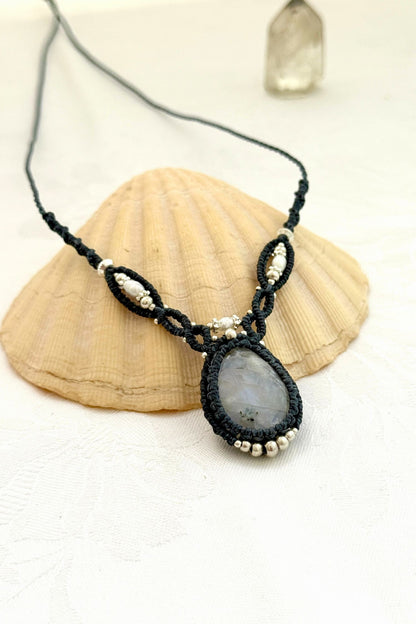 Another Side view of a handmade Moonstone macrame necklace showing the flashes and natural beauty of the gemstone