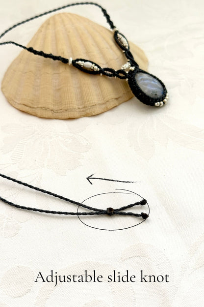 Close-up of adjustable sliding knot on handmade macramé necklace, allowing a customizable fit for all sizes
