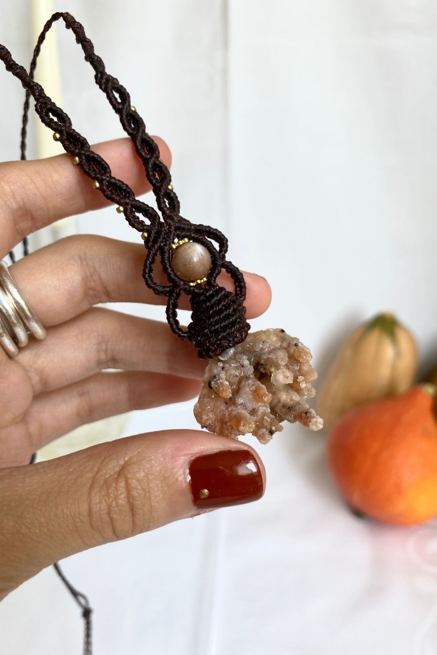 Detailed view of the handmade necklace, highlighting the raw textures of natural Raw Chalcedony and Peach Moonstone gemstones in a distinctive, statement-making design.