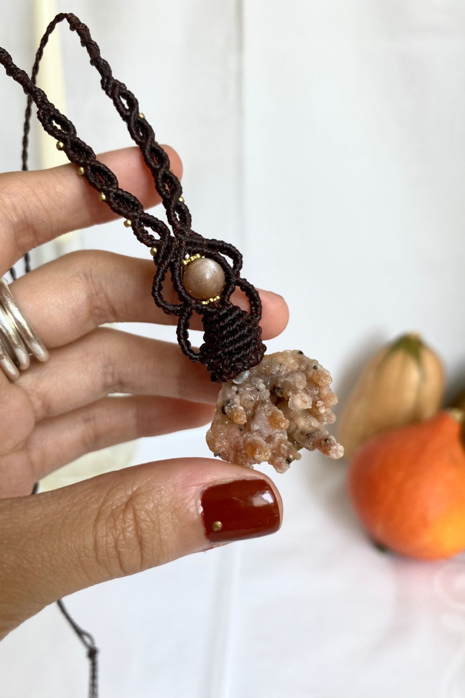 Detailed view of the handmade necklace, highlighting the raw textures of natural Raw Chalcedony and Peach Moonstone gemstones in a distinctive, statement-making design.