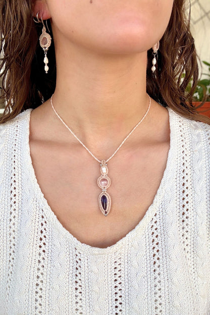 Freshwater Pearl, Rose Quartz and Amethyst macrame necklace worn by a model. Showcasing the unique handmade design and how it looks when worn.