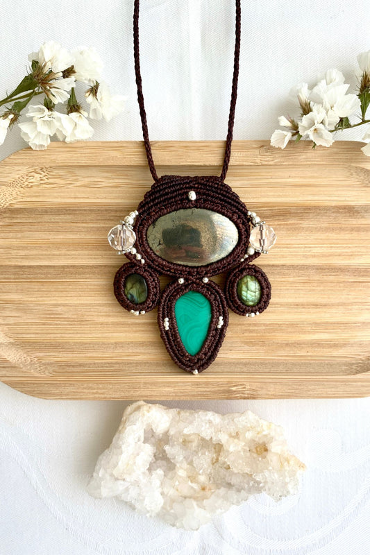 Handmade macrame necklace featuring Pyrite, Labradorite, Malachite and Quartz gemstones, crafted with a unique and artistic design, offering an adjustable length for a perfect fit.