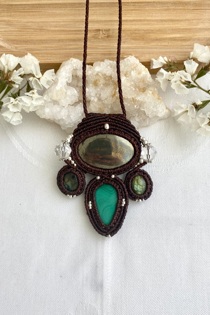 A close-up of the handmade gemstone necklace, showcasing the natural beauty of Pyrite, Labradorite, Malachite and Quartz in an exclusive, one-of-a-kind design.