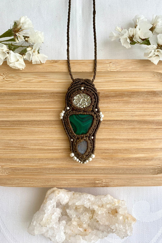 Handmade macrame necklace featuring  Raw Pyrite, Malachite and Moonstone gemstones, crafted with a unique and artistic design, offering an adjustable length for a perfect fit.