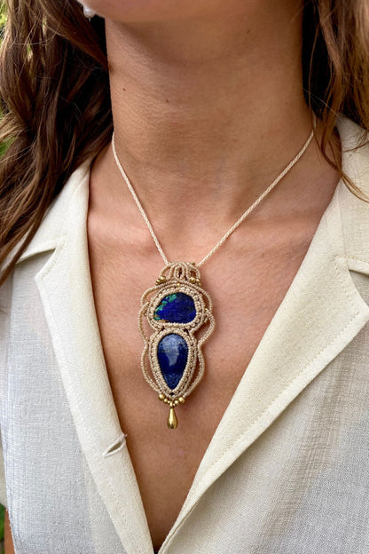 Artistic jewelry display of a one-of-a-kind macrame necklace, featuring hand-selected gemstones in a timeless and elegant design.