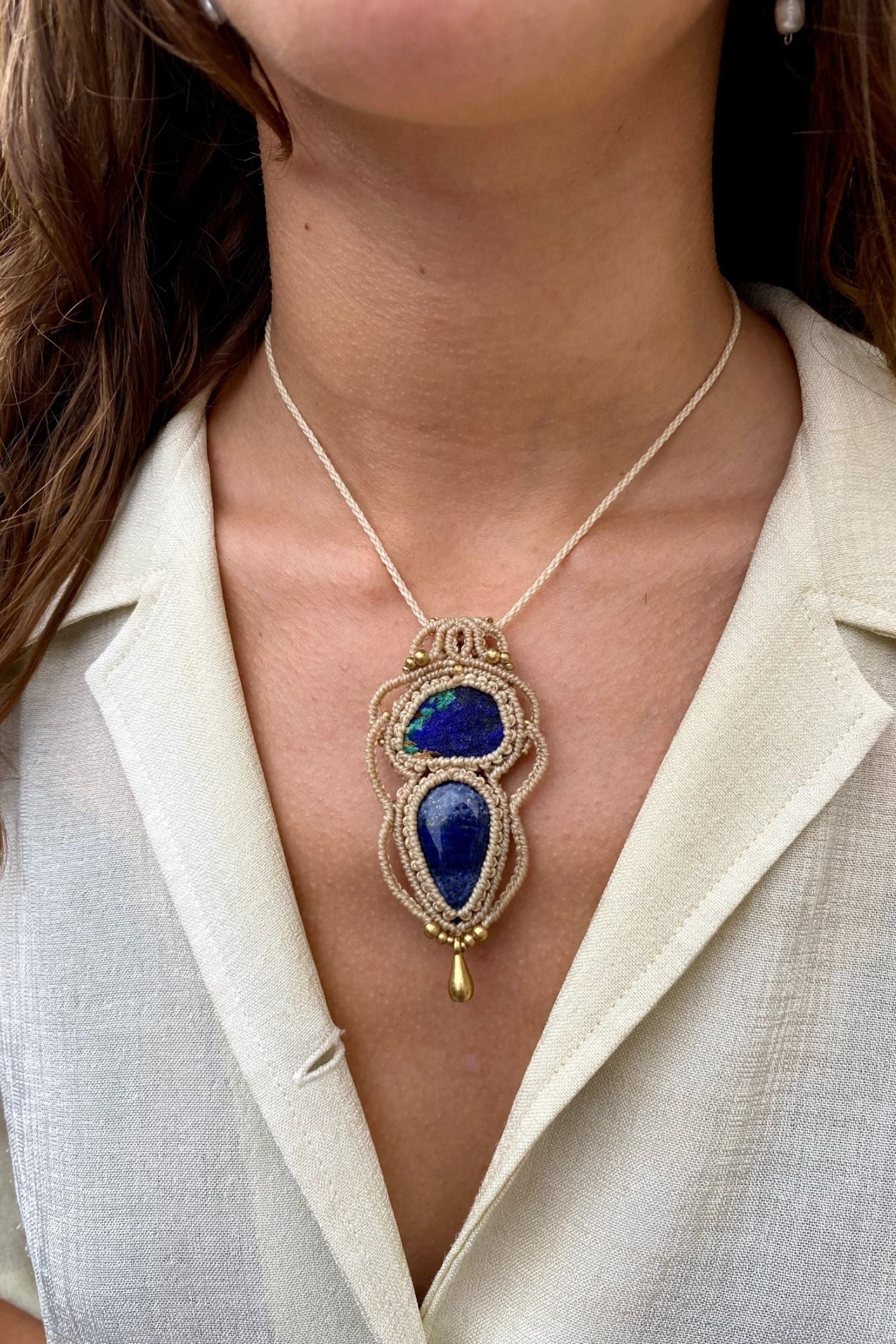 Handmade gemstone necklace worn, showing how the unique Raw Azurite and Lapis Lazuli pendant elegantly rests on the neckline.