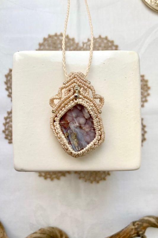 Handmade macrame necklace featuring a Raw Pink Chalcedony Stalactite gemstone, crafted with a unique and artistic design, offering an adjustable length for a perfect fit.