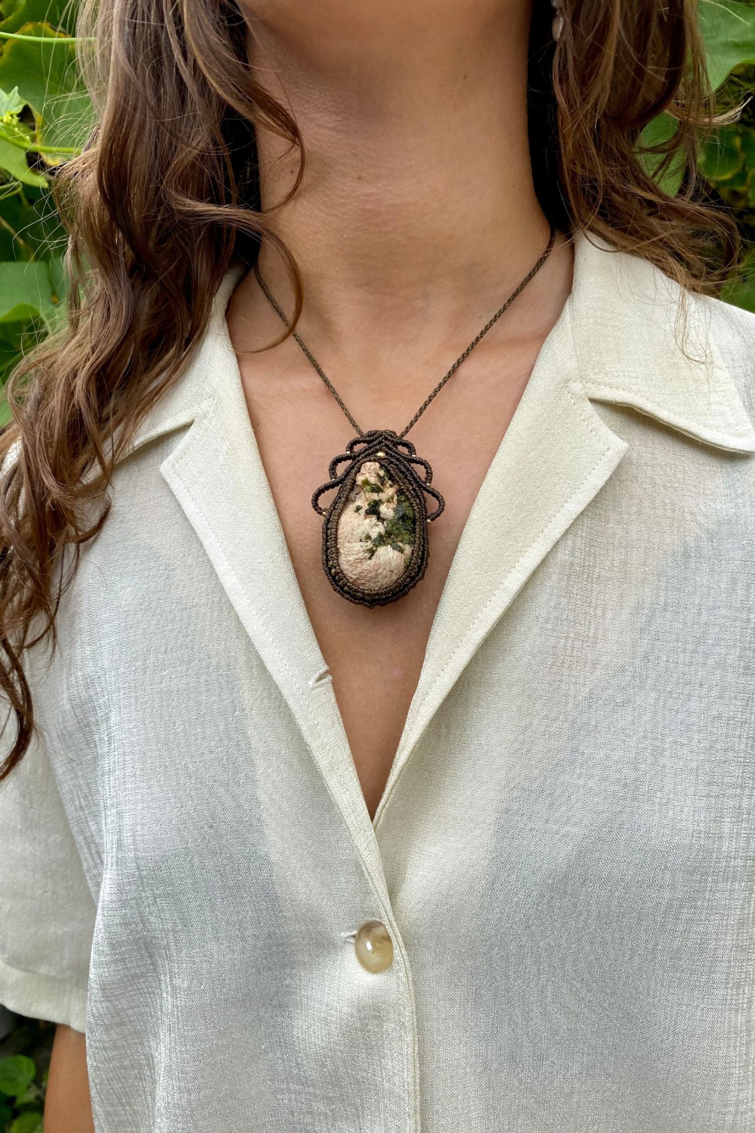 Handmade macrame necklace featuring a raw Prehnite and Epidote gemstone, crafted with a unique and artistic design, offering an adjustable length for a perfect fit.