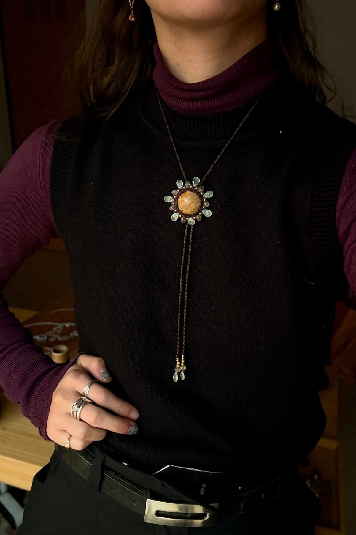 Model styling one of a kind sea urchin fossil bolo tie, bold contemporary fossil jewelry