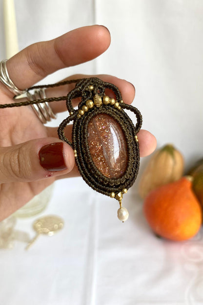 Detailed view of the handmade necklace, highlighting the raw textures of natural Sunstone gemstone and Pearl in a distinctive, statement-making design.