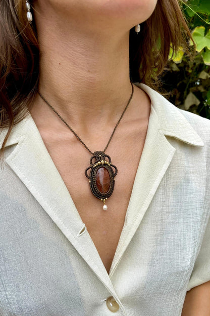 Handmade gemstone necklace worn, showing how the unique Sunstone and Pearl pendant elegantly rests on the neckline.