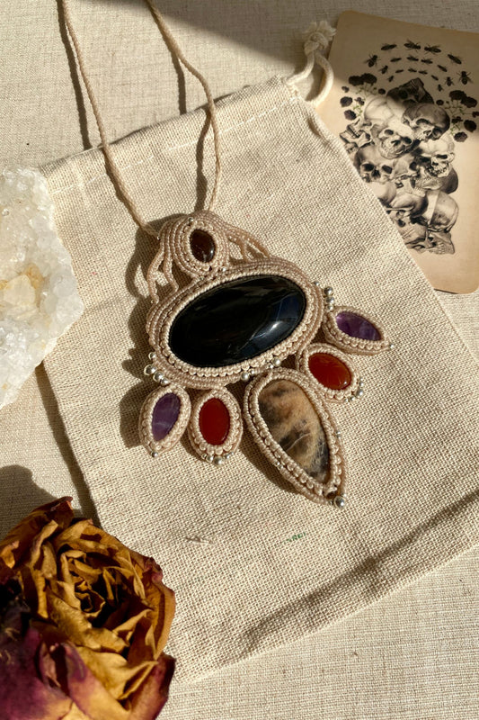 Handmade multi-gemstone macrame necklace featuring Obsidian, black moonstone, smoky quartz, carnelian, and amethyst, blending elegance and bold design.