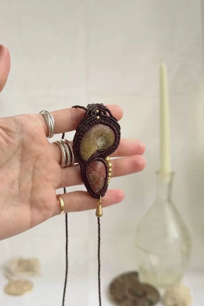 Opalized ammonite pendant necklace showing iridescent fossil tones and natural sparkle of sunstone, highlighting dangling movement