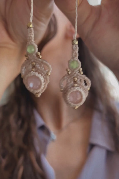 Video showcasing handmade macrame earrings with rose quartz and prehnite gemstones, demonstrating their lightweight feel, elegant movement, and how they shine in light when worn.