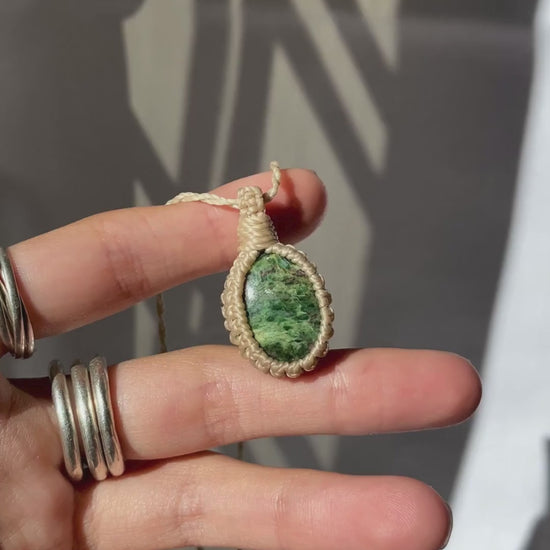 Video of the handmade Ruby Fuchsite Macrame necklace, highlighting the ruby details and the deep green tones of the gemstone, as the lightweight, minimalist macrame design.