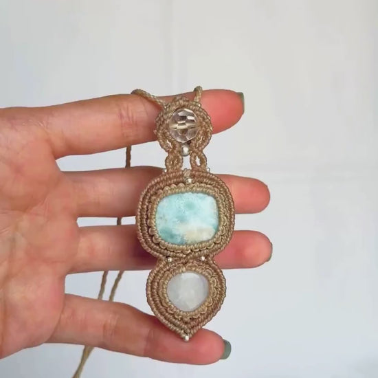 Close-up video of the Larimar, quartz and Moonstone pendant, highlighting the gemstone details and the Moonstone’s iridescent shimmer.