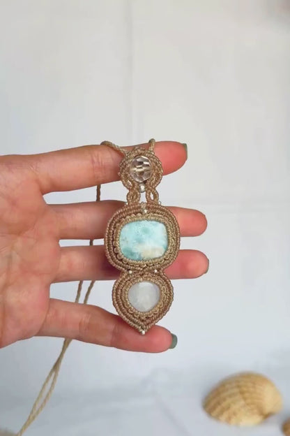 Close-up video of the Larimar, quartz and Moonstone pendant, highlighting the gemstone details and the Moonstone’s iridescent shimmer.