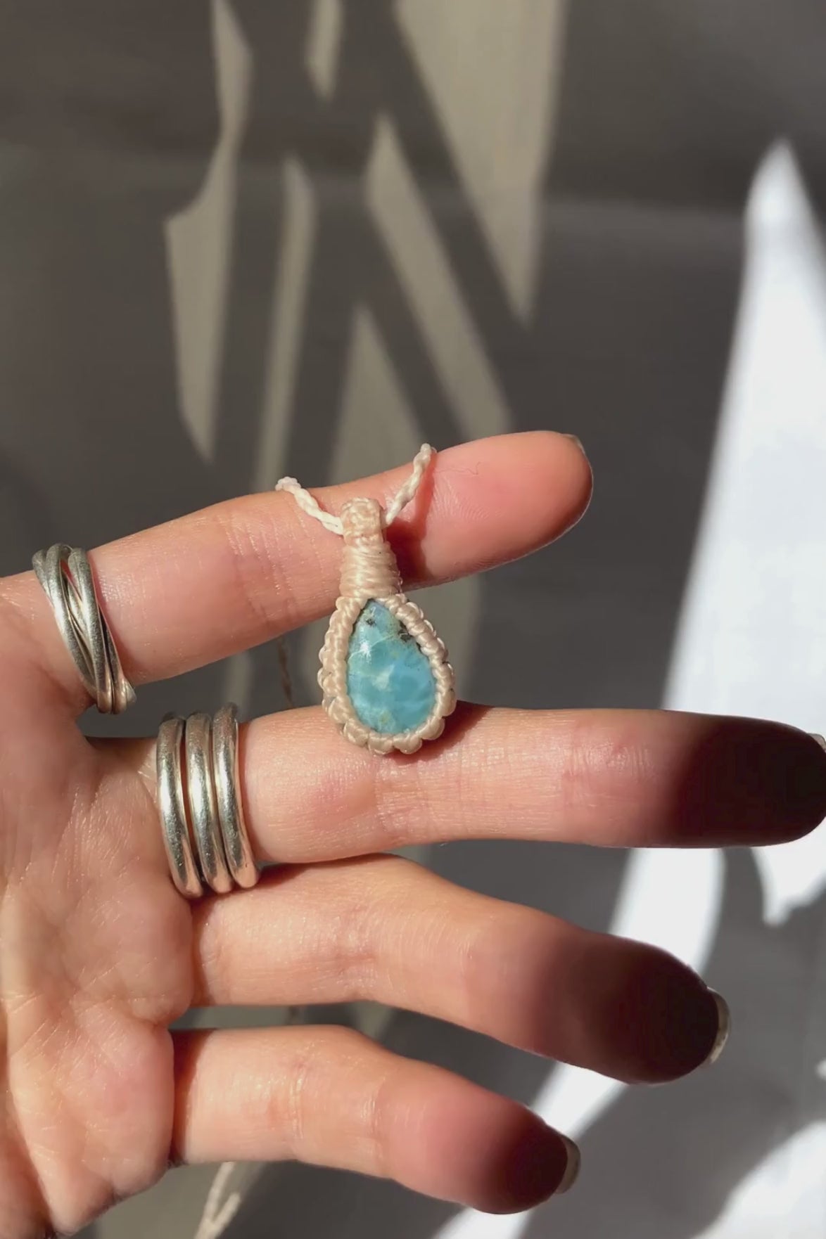 Video of the handmade Larimar Macrame necklace, highlighting the deep blue tones of the gemstone and the lightweight, minimalist macrame design.