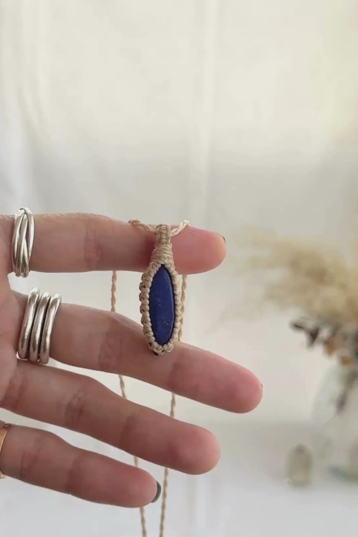 Video of the handmade Lapis Lazuli Macrame necklace, highlighting the vibrant tones of the gemstone and the lightweight, minimalist macrame design.